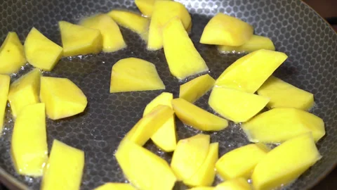 Potatoes are fried in a pan, close-up Stock Footage 248069133
