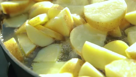 Potatoes are fried in a pan Stock Footage 136329919