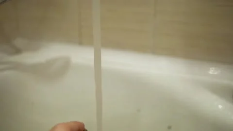 Potatoes are washes with their hands by a white man. Under the pressure of water Stock Footage 130282823