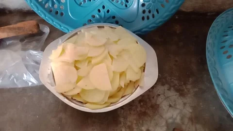 Potatoes Being Cut for Cooking Stock Footage 346746697