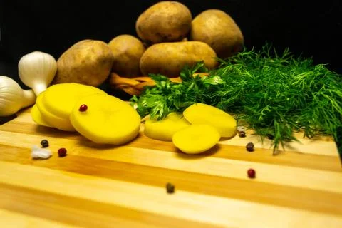 Potatoes on a black background Stock Photos