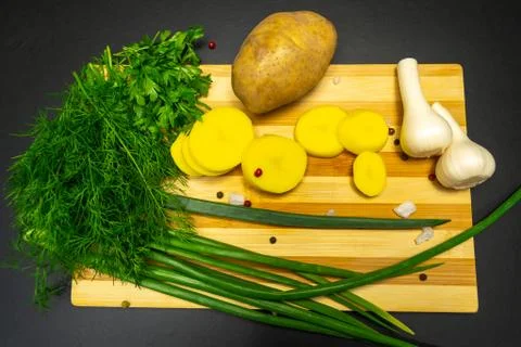 Potatoes on a black background Stock Photos