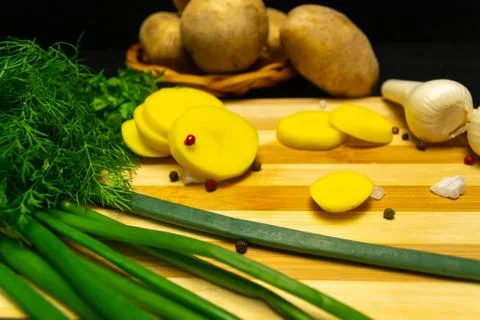 Potatoes on a black background Stock Photos