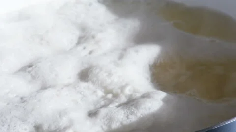 Potatoes Boiling in Pot with Bubbles Close Up, 4K Stock Footage 61529778