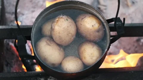 Potatoes Boiling in Pot on Fire Stock Footage 303824837