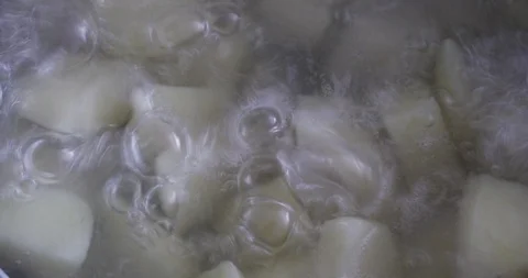 Potatoes in boiling water, close-up Stock Footage 97383616