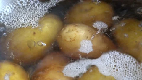 Potatoes boiling in water. Selective focus. Stock Footage 169792570