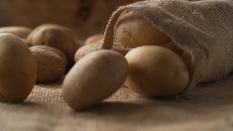 Potatoes in a burlap bag. Slow Motion. Stock Footage 89613607