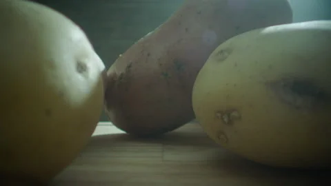 Potatoes in the composition falling laowa macro lens Stock Footage 198701729