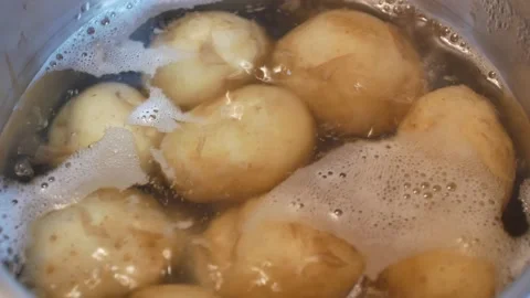 Potatoes cooking in boiling water Stock Footage 156784673