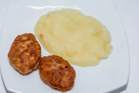 Potatoes with cutlets Stock Photos