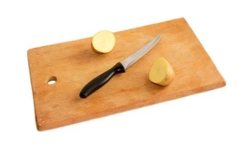 Potatoes on a cutting board Stock Photos