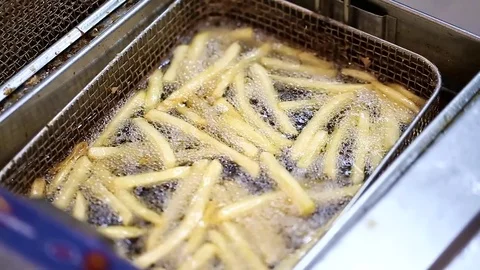 Potatoes fried in a deep fryer Stock Footage 72743969