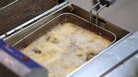 Potatoes fried in a deep fryer Video stock 72857670
