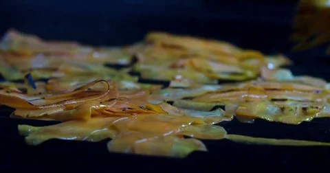 Potatoes fried on grill oven 4k video. Chef cooking sliced vegetables restaurant Stock Footage 70005318