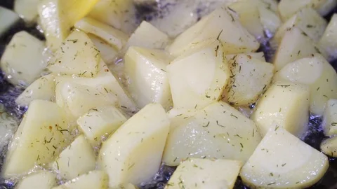 Potatoes fried in a pan close-up and stirred Stock Footage 102176024