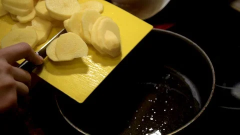 Potatoes Frying Process. Mixing The Fried Potatoes Stock Footage 102394734