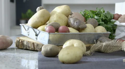 Potatoes on kitchen worktop dolly right Stock Footage 63779371