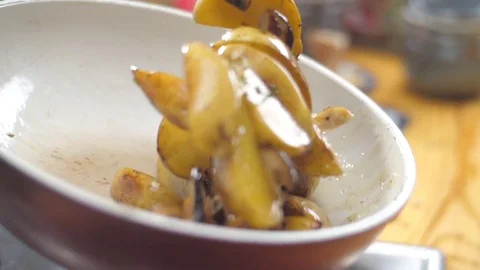 Potatoes with mushrooms in the pan Stock Footage 82503483