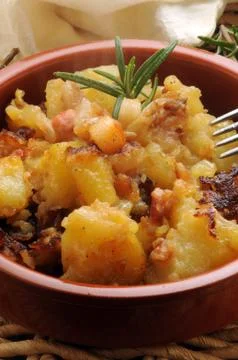 Potatoes in a pan with bacon Stock Photos