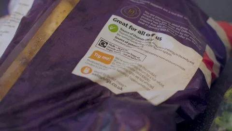 Potatoes in plastic packaging on kitchen counter Stock Footage 115254450