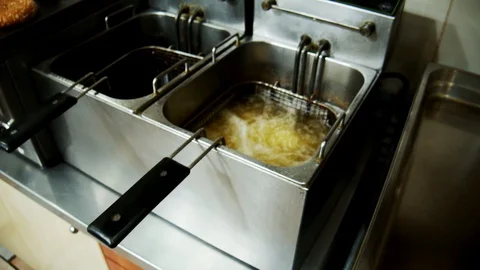 Potatoes in a professional kitchen moving camera slow motion Video stock 129110247