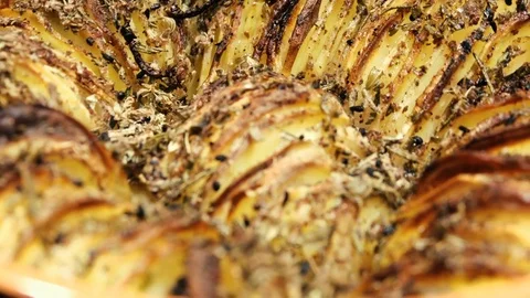 Potatoes stew in rotating casserole clay close-up Stock Footage 74139575