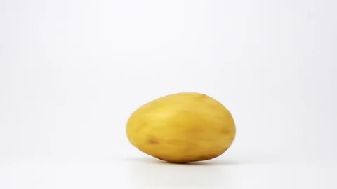 Potatoes turn on a white background. 4k. Stock Footage 88826348