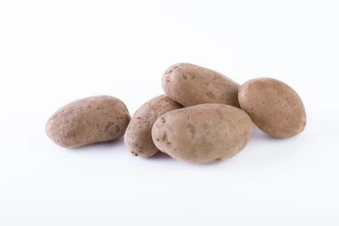 Potatoes on a white background. Stock Photos