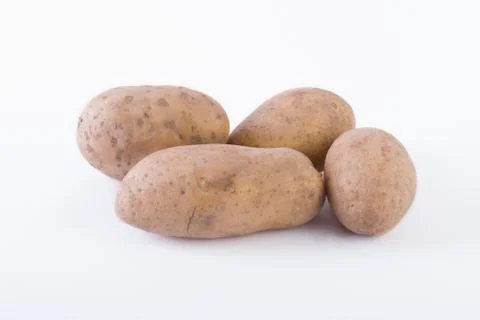 Potatoes on a white background. Stock Photos