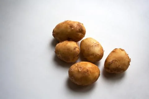 Potatoes on white background Stock Photos