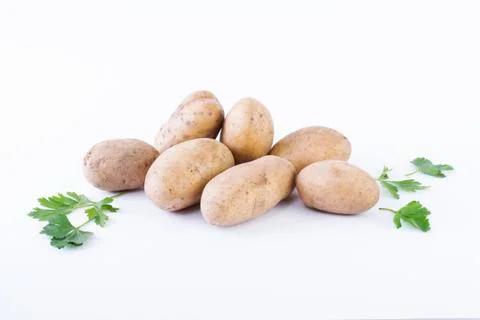 Potatoes on a white background. The vegetable on a white background. Stock Photos