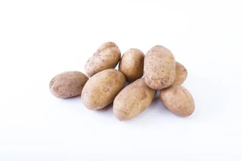 Potatoes on a white background. The vegetable on a white background. Stock Photos