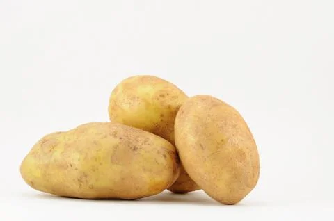 Potatoes on white Stock Photos