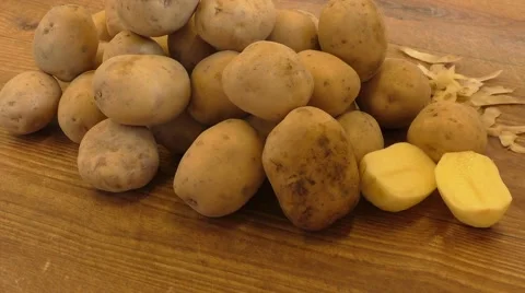 Potatoes on wooden table close up Stock Footage 54317784