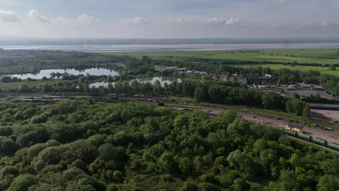 Potential development land at Lydney with River Severn behind aerial Stock Footage 294923103