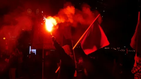 Potesters having a red flares Stock Footage 99875510