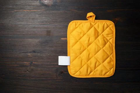 Potholder on wooden background Stock Photos