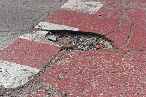 Pothole at crossing Stock Photos