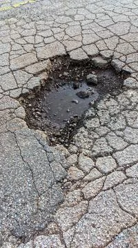 Pothole In Damaged Road 库存照片