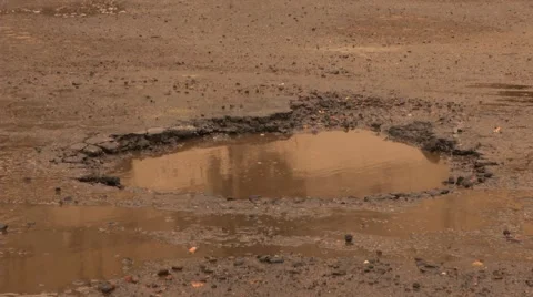 Pothole Large Wet 1 Stock Footage 40340590