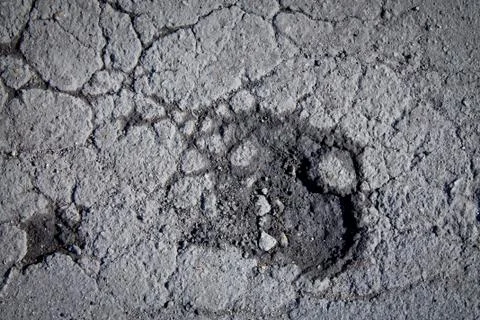 Pothole in pavement Stock Photos