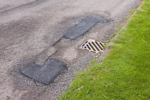 Pothole repair. Patch repairs of UK country road Stock Photos
