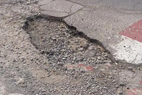 Pothole in road Stock Photos