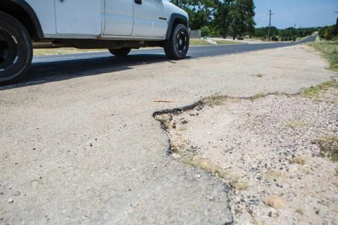 Pothole on the side of the road Stock Photos