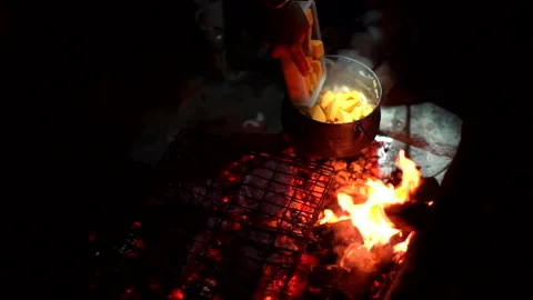 Potjiekos cooking on a fire Stock Footage 308917440