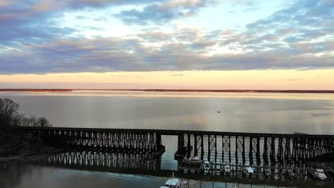 Potomac River at sunset passing train bridge 動画素材 104011374