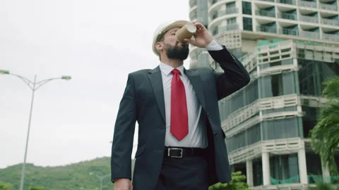 Potrait Senior Engineer production engineer at work in a business suit walking Stock Footage 163418223