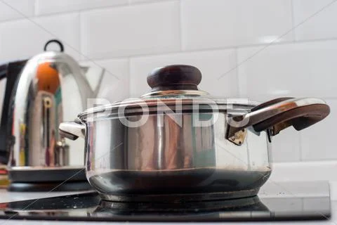 Pots And Pans Cooking On Stove