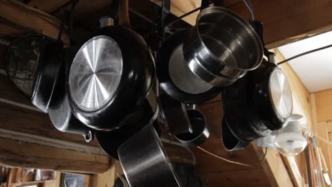 Pots and Pans Hanging from Ceiling at Camp in Log Cabin Stock Footage 124818213